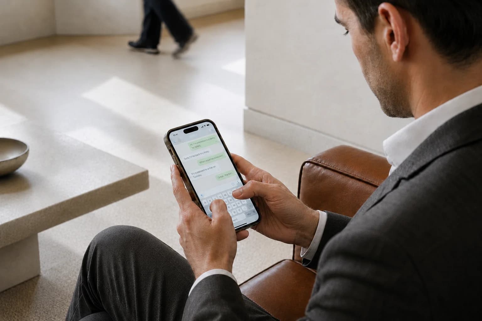 An executive working with an AI assistant in WhatsApp